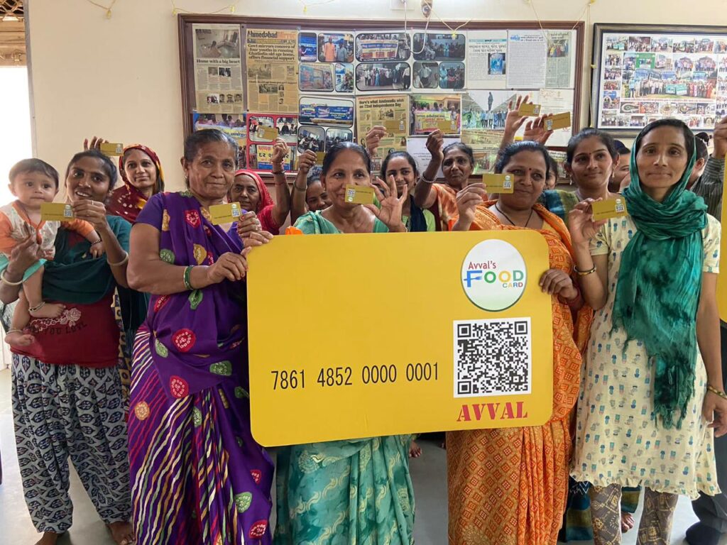 A group of people holding Avval Food Cards.